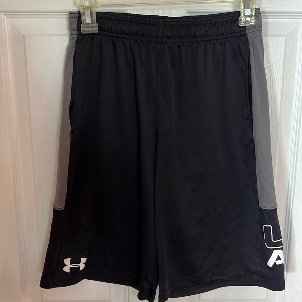 Under armor shorts size ylg in black and grey with white writing like new